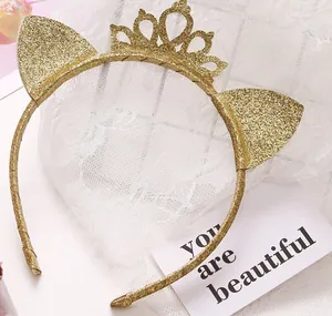 Close-up of golden glitter cat ear headband with crown for party and celebration