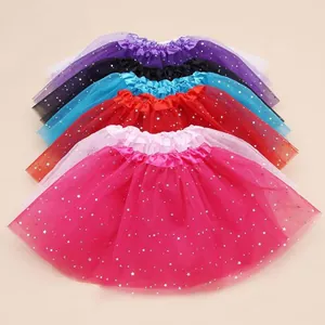 Stack of colorful tulle tutu skirts featuring shiny silver star patterns for parties