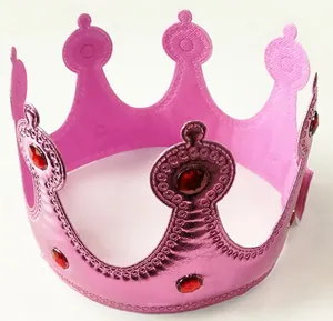 Detail of pink metallic birthday crown with red gemstone accents.