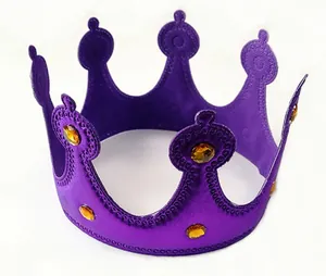 Macro view of a purple party crown with orange faceted rhinestones for birthday events.