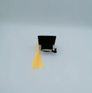 Mini graduation cap hair clip accessory with yellow tassel for graduation party decor