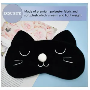 Detail view of a cute black cat plush sleep mask made of premium soft warm fabric
