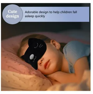 Detail view of a cute black cat plush eye mask on a sleeping child for deep rest