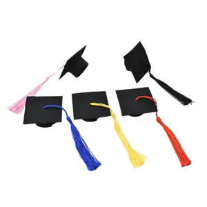 Mini black graduation caps with colorful tassels for festive graduation party decoration