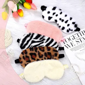 Plush rabbit fur sleep eye masks in dalmatian, zebra, and leopard patterns for cozy rest.