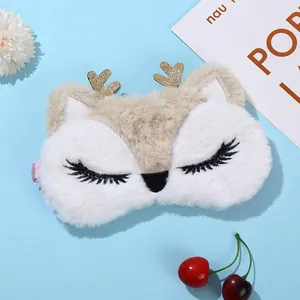 Plush reindeer sleep mask with gold glitter antlers and embroidered long eyelashes