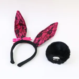 Detailed view of pink lace bunny ear headband and black furry tail costume accessories