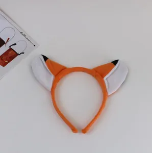 Detail view of plush orange fox ear headband for Halloween and costume party dress-up