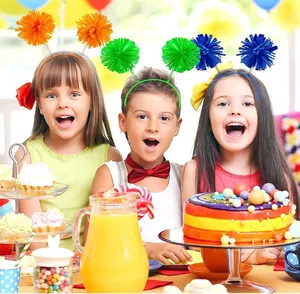 Colorful woolen pom pom headbands worn by children at a vibrant birthday party celebration