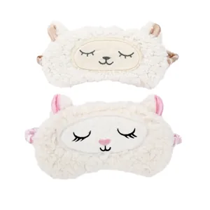 Close-up of two cute cartoon plush sleep eye masks with soft sheep and cat face embroidery