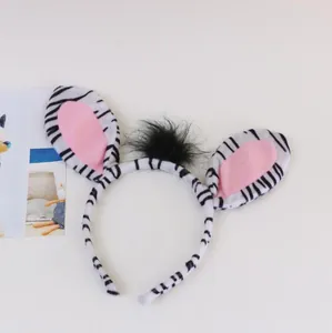Close-up of zebra pattern animal headband with plush ears and black faux fur detail