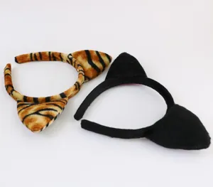 Detail view of plush tiger and black cat ear headbands for costume party cosplay