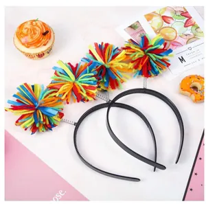 Detail shot of colorful yarn pom-poms on spring headbands for festive parties.