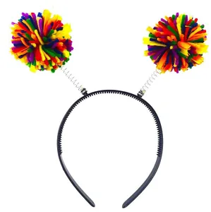 Detailed view of vibrant multi-colored yarn pompom headband featuring bouncy metal springs