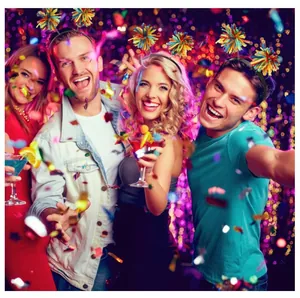 Cheerful group wearing colorful yarn pom-pom headbands at a vibrant festive party