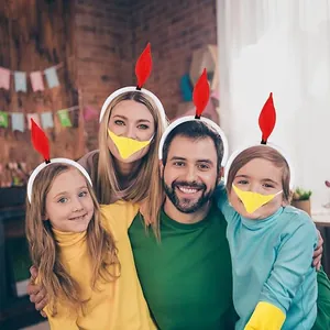 Happy family wearing festive turkey headbands and yellow beak masks for a Thanksgiving party.