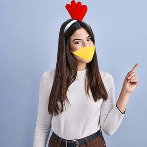 Model wearing turkey party headband and yellow beak mask for Halloween costume