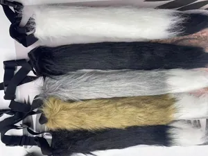 Close-up detail view of multi-colored faux fur tails with adjustable straps for cosplay