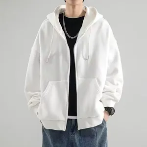 Vue détaillée de face d'un sweat à capuche blanc uni avec fermeture éclair et poches