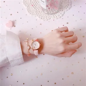Close-up of pink girls watch with cat ear case and matching star bracelet on wrist