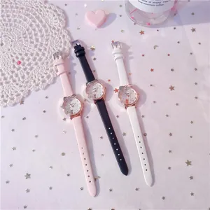 Detailed close-up showing three cute cat-ear girls' watches in pink, black, and white colors.
