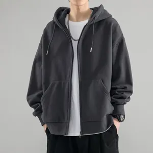 Close-up detail of a men's dark grey zip-up hooded sweatshirt with fleece lining