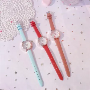 Detailed view of three cute cat-ear girls' wristwatches in light blue, red, and brown tones.
