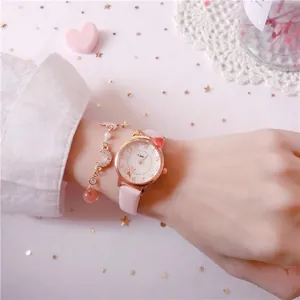 Pink girls cat-eared watch set with celestial charm bracelet and rose gold accents.