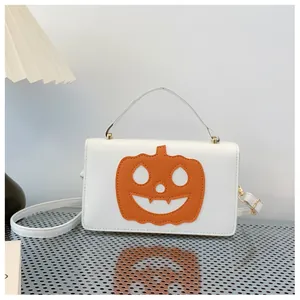 Halloween pumpkin themed white handbag with orange jack-o'-lantern patch