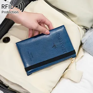 Blue leather RFID blocking passport holder and multi-functional travel wallet for security.