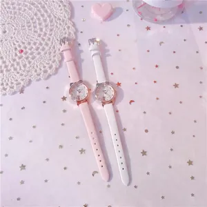 Close-up of pink and white cat-ear watches for girls featuring a dreamy star background