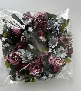 Detail of artificial peony wreath inside protective plastic packaging