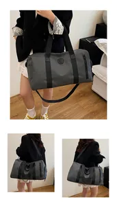 Detail view showing the large capacity and multiple carrying modes of a grey gym duffel bag