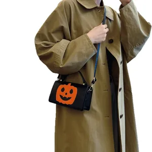 Stylish Halloween pumpkin crossbody handbag for women with orange and black contrast design