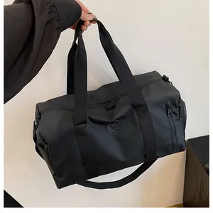 Large capacity black gym bag with dry-wet separation for travel and fitness.