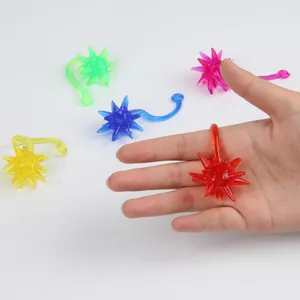 Colorful sticky meteor hammer toy made of soft TPR rubber shown wrapped on finger.