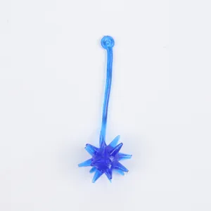 Detailed view of a blue translucent sticky flail toy with spiked ball end.