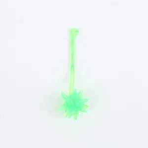 Detailed view of a translucent green sticky meteor hammer toy with soft spikes