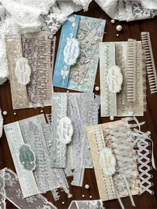 Detail of PET white ink long sticker packs with elegant lace and ribbon patterns.