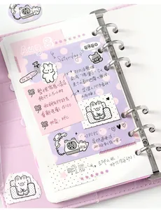 Detailed view of cute cartoon sticky notes and stickers inside a purple loose-leaf binder