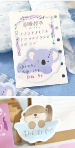 Close-up of cute koala and otter shaped sticky notes showing detailed animal illustrations.