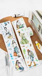 Macro view of watercolor hand-drawn girl stickers for journaling and scrapbooking