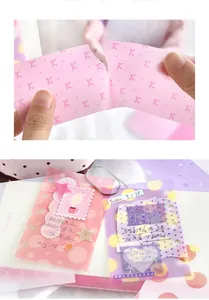 Close-up of translucent vellum paper notes for scrapbooking with torn edge texture