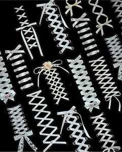 Detailed view of PET long strip stickers featuring elegant white lace ribbon patterns