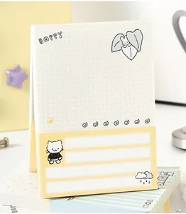 Macro view of NOTE FOR cute cartoon cat memo pad with dot grid, 80 sheets of paper.