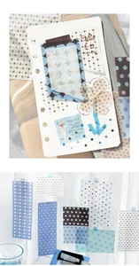 Detailed view of translucent vellum paper notes featuring blue polka dots and heart patterns