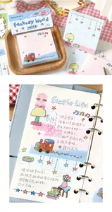 Cute doodle style memo pads used in a scrapbook binder with colorful illustrations