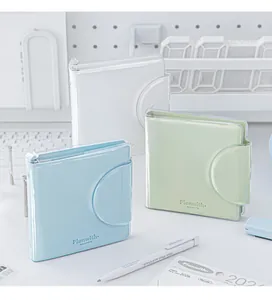 Minimalist Jelly series magnetic notebooks in pastel white, green, and blue on a desk.