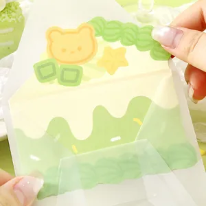 Creative cute cake-shaped greeting card featuring a sweet bear and star design in green
