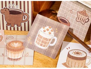 Macro shot of cute coffee-themed mini sticky notes for journaling and scrapbooking
